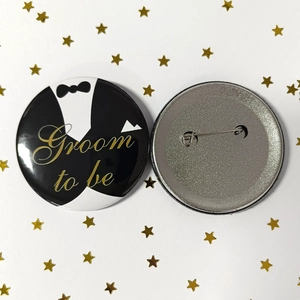 Front and back detail of Groom to be tinplate badge with tuxedo design and safety pin