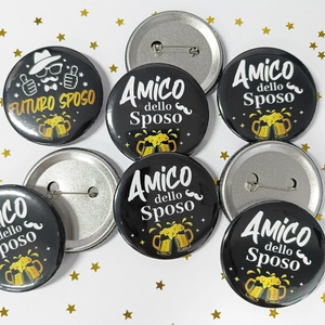 Detail of tinplate wedding badges with Italian Groom and Groomsman party slogans