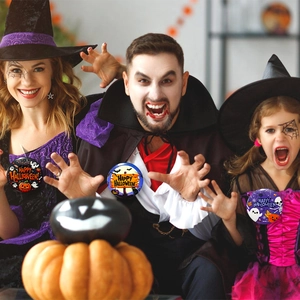 Three people wearing Halloween tinplate badges with pumpkins and ghosts on clothing