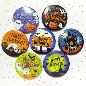 Detailed close-up of 58mm Halloween tinplate badges with pumpkin and ghost motifs