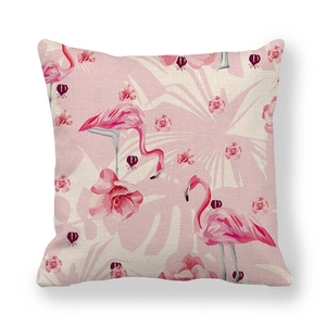 Detailed macro view of linen pillowcase with pink flamingo and floral pattern