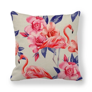 Detail of flamingo and rose pattern on textured beige linen blend cushion cover