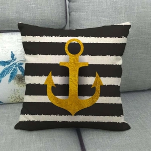 Detail of nautical pillow case with gold glitter anchor on black and white stripes