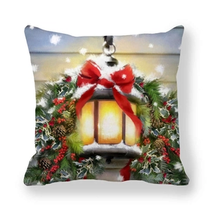 Detailed view of Christmas pillowcase with lantern, red bow, pine cones and snow