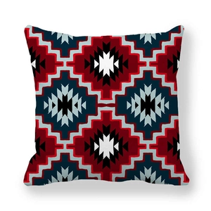 Close-up of geometric ethnic pattern on peach skin fabric square pillow cover