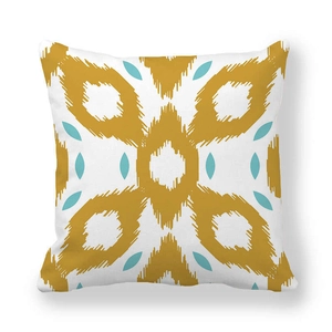 Detail of square peach skin pillowcase with mustard yellow and blue geometric ikat pattern