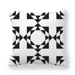 Close-up of peach skin fabric texture with black and white symmetric geometric patterns