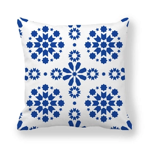 Close-up of geometric blue tile pattern and texture on peach skin pillow cover
