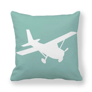 Funda de cojín turquesa cuadrada con silueta de avión blanca de estilo minimalista