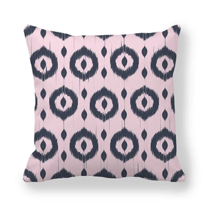 Detail of soft peach skin pillowcase with blue geometric circles on pink background