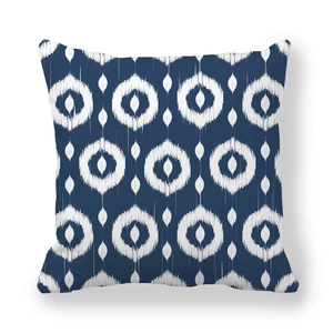 Detail of square navy blue and white ikat geometric pattern peach skin pillow cover