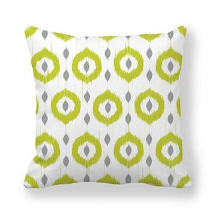 Detail of peach skin fabric with yellow geometric ikat pattern on square pillowcase