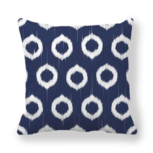 Detailed view of navy blue ikat geometric pattern on thick peach skin pillowcase