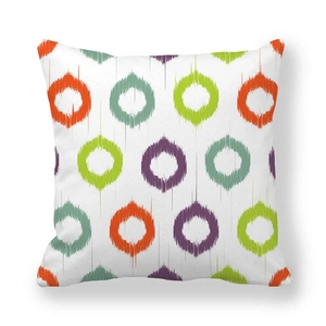 Macro detail of the soft peach skin fabric texture on this geometric patterned cushion cover