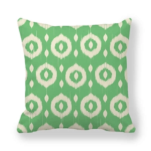 Green Ikat geometric square pillowcase in thick peach skin fabric on white background