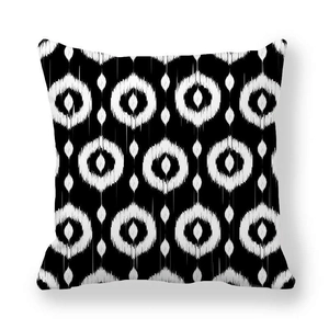 Minimalist black and white geometric ikat pattern pillowcase on a clean white backdrop