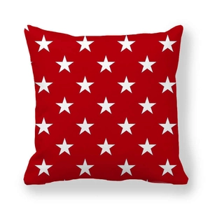 Detailed close-up of a red peach skin pillowcase featuring white star patterns