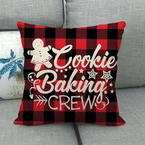 Detail of red and black buffalo plaid linen pillow cover with Cookie Baking Crew print