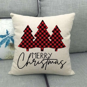 Detail of linen Christmas pillowcase with buffalo plaid trees and Merry Christmas text