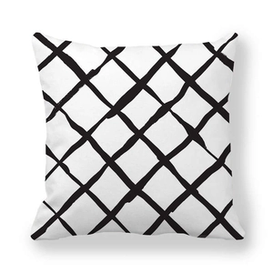 Close-up of minimalist black and white grid pattern pillowcase with soft texture
