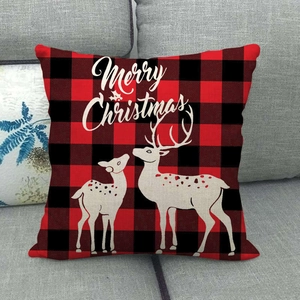 Close-up of red and black buffalo plaid linen pillowcase with white reindeer silhouette