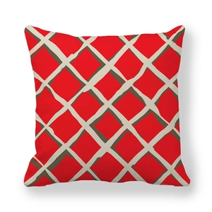 Macro detail of red velvet cushion cover featuring a white hand-drawn grid pattern