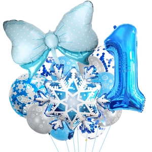 Blue snowflake themed first birthday balloon set with numbers and foil bow accents