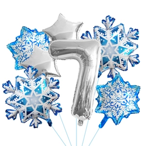Detail of silver number 7 balloon with blue snowflake star balloons for party decor