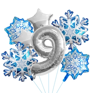 Close-up of frozen theme balloon set featuring silver number nine and blue snowflakes