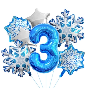 Close-up of blue number 3 foil balloon with snowflake pattern and silver stars