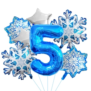 Detail of blue number 5 foil balloon with silver stars and snowflakes set for party deco