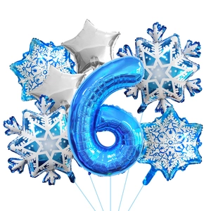 Detail of blue number 6 foil balloon set with silver stars and winter snowflakes