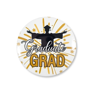 Close-up of a round graduation badge featuring gold fireworks and Graduate text on white