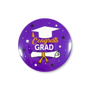 Detailed macro view of a purple circular graduation pin featuring Congrats GRAD text