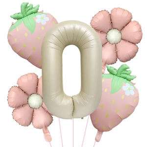 Pastel pink strawberry and flower foil balloons with cream number zero for party decor