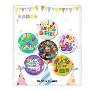 Detailed set of six colorful Happy Birthday tinplate badges on decorative display card