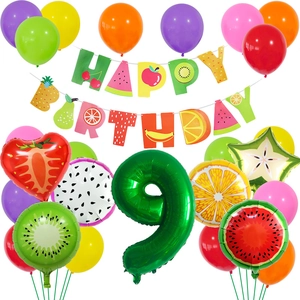 Detail of 9th birthday party kit with fruit-themed banner and aluminum number balloons