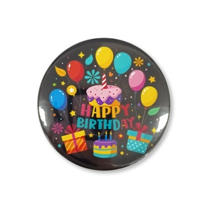 Glossy Happy Birthday tinplate badge with colorful cake and balloon motifs on black background