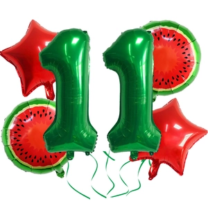 Detail of watermelon theme party balloon set with foil numbers, stars and fruit prints