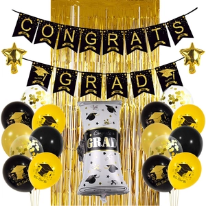 Graduation party decoration kit with black gold banner, foil balloons, and fringe curtain