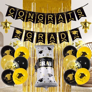 Black and gold graduation party set with Congrats Grad banner and foil balloons