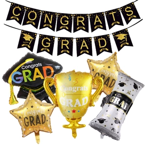 Black and gold graduation party set with Congrats Grad banner and trophy balloons