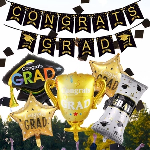 Outdoor graduation party set with black gold banners and shaped foil balloons decoration