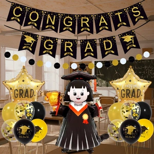 Detail of Congrats Grad black and gold graduation banner with festive balloons and decor