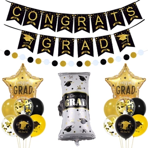 Macro detail of congrats grad banners and black gold balloon set for graduation parties