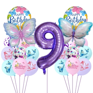 Flat lay of blue and purple butterfly balloon set for 9th birthday party decoration
