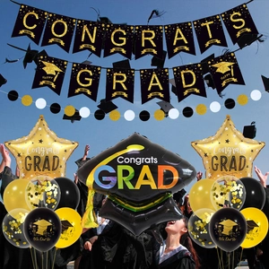 Black and gold graduation party set with Congrats Grad banner and trophy balloons