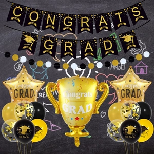 Black and gold graduation party set with Congrats Grad banner and trophy balloons