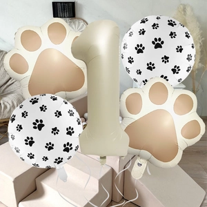 Detailed set of paw print balloons and a large cream foil number one for party decor