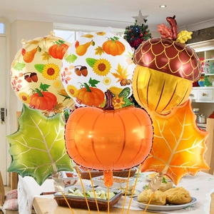 Detail of harvest festival balloon set with pumpkin maple leaf and acorn foil shapes